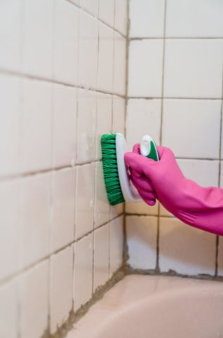 scrubbing-shower-tiles