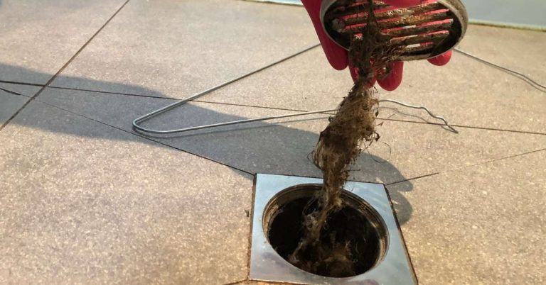 How to unclog a shower drain - removing hair buildup from drain cover