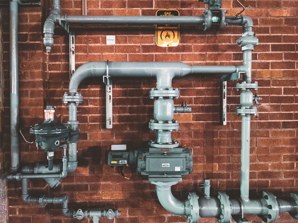 Water softener system with salt tank installed in home utility room — water softener cost 2026